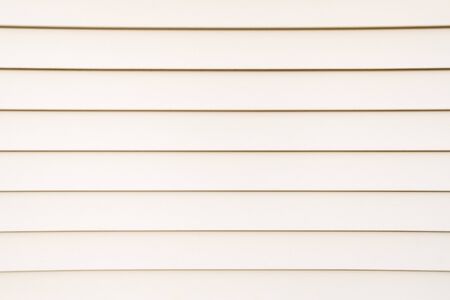 White background of pale striped wooden boards.の写真素材