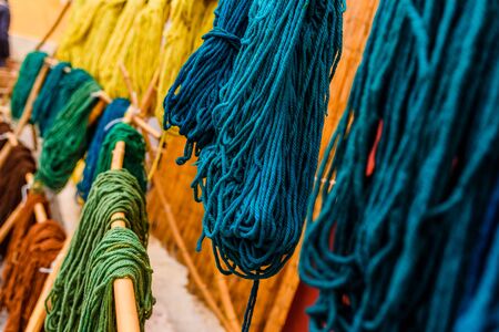 Yarns of colored wool freshly dyed by Arab craftsmen drying in the sun.の写真素材