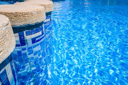 Pillars inside a pool to separate bathing areas.