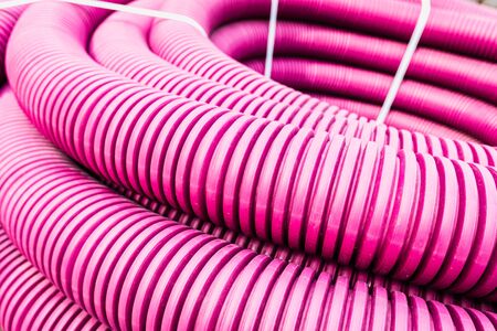 Detail of plastic cylindrical tubes to protect buried city cables.の写真素材