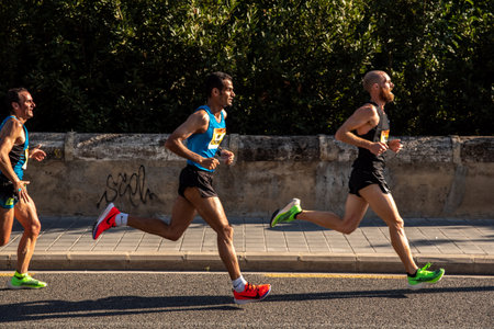 Valencia, Spain - October 27, 2019: Participant in a half marathon race running on the asphalt of the city of Valencia,  Nike vaporfly nextのeditorial素材