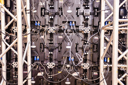 Valencia, Spain - November 17, 2019: Led panel of a giant screen seen from behind, of the Alfalite brand, with dozens of complicated electronic connections.のeditorial素材