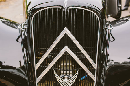 Valencia, Spain - June 25, 2019: Detail of the radiator of a black vintage car of Citroen brand.