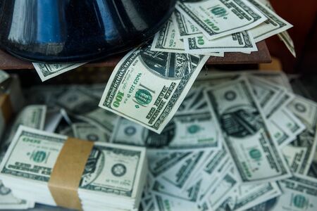 Stack of fake dollar bills piled up.