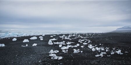Giant ice blocks detached from icebergs on the coast of an Icelandic beach.