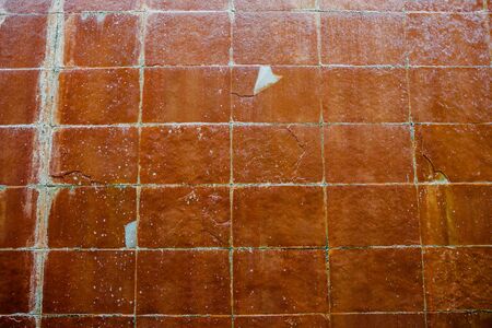 Wall dampened by the rains that overflow and wet the tiles.の写真素材