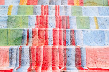 Steps profusely decorated with floral motifs painted during a street festival.の写真素材