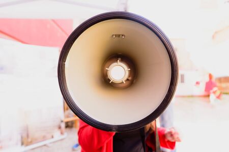 Close-up of a megaphone held by a woman during a demonstration.の写真素材
