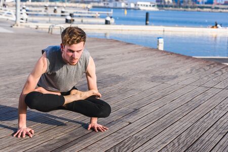 Bakasana, yoga posture of an asana that balances the arms