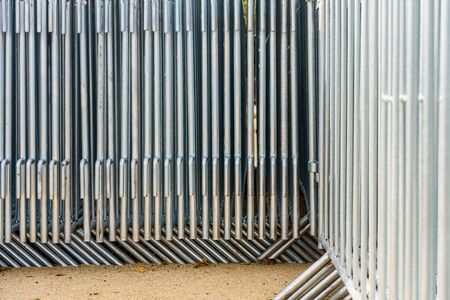 Detail of portable steel barriers stacked together before a public eventの写真素材