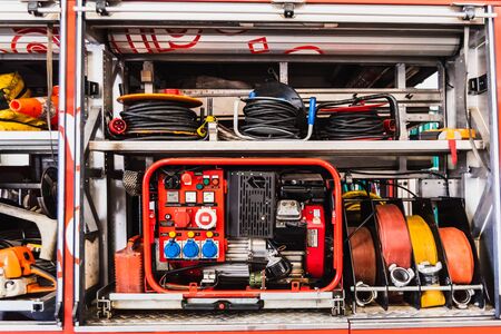 Emergency material of a fire truck, with generator set and hoses.の写真素材