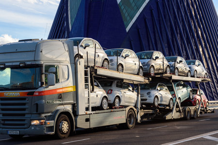 Valencia, Spain - March 5, 2020: A truck transports new Fiat brand cars to a dealership.のeditorial素材