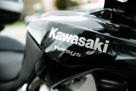 Valencia, Spain - March 5, 2020: Kawasaki Versys logo on the fuel tank of a black motorcycle.のeditorial素材