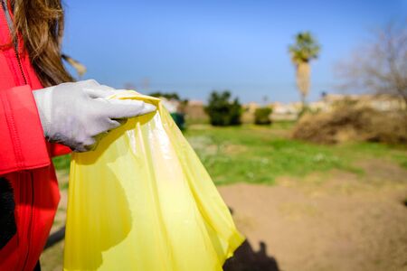 Garbage bags full of plastic bottles abandoned in nature recycled by volunteers.の写真素材