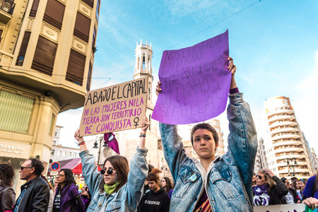 Valencia, Spain - March 8, 2020: Young women holding placards with messages for feminist women's equality during a protest rally.のeditorial素材