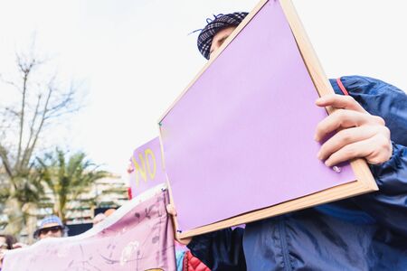 Blank banners held by people during demonstrations, to be completed with text.の写真素材