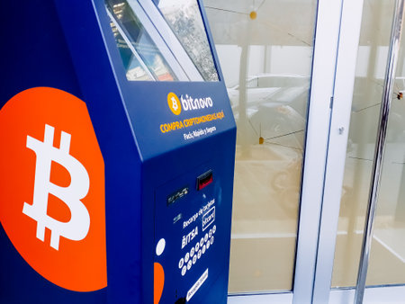 Valencia, Spain - April 26, 2020: Automatic bitcoin ATM vending machine placed on the street for public use.のeditorial素材