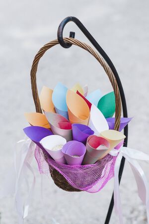 Colorful paper cones with rice inside, to throw them to the newlyweds at a wedding.の写真素材