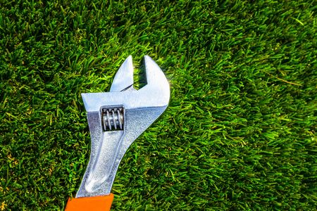 Monkey wrench on artificial grass, copy space.の写真素材