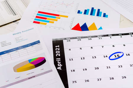 Tax payment day of 2021, in April, a calendar with balance documents.の写真素材