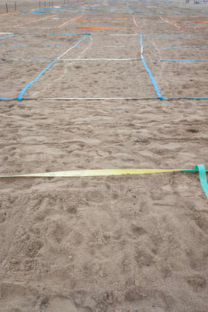 An empty Mediterranean beach with space separations during the summer of 2020 with the new normality after the pandemic.の写真素材