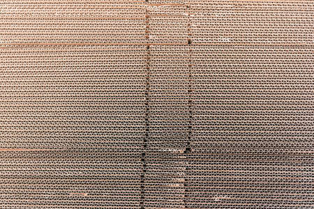 Detail of a corrugated cardboard stacked in sheets.