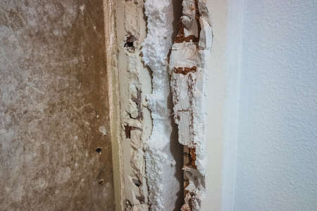 Interior of a brick veneer wall, insulated with acoustic material and anti-humidity between the...