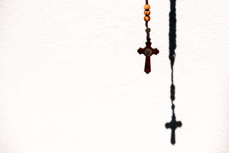 Rosary with wooden beads and Christian cross.の写真素材