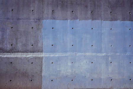 Urban background of a cement wall with lines of blue tones.