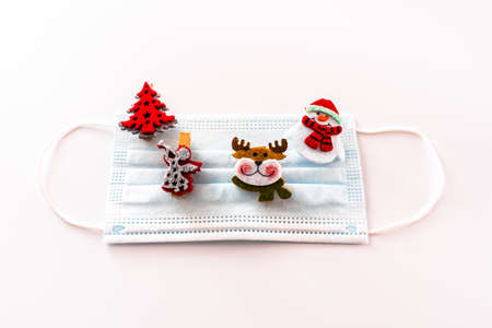 Christmas decoration isolated on white background with masks to avoid virus infections.の写真素材