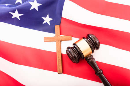 American flag with Christian cross and gavel of justice.の写真素材