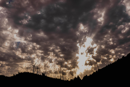 Wind turbines viewed from below help decontaminate the air.の写真素材