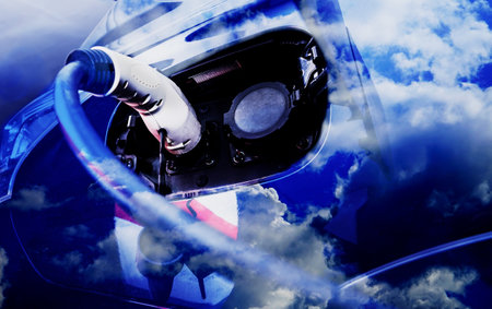 Composition of an electric car recharging its batteries with reflections of the clean cloud sky of...