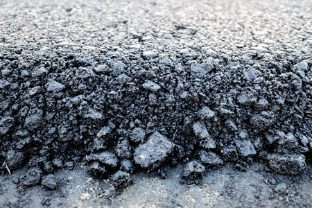 Asphalt layer just spread on a new road, detailの写真素材