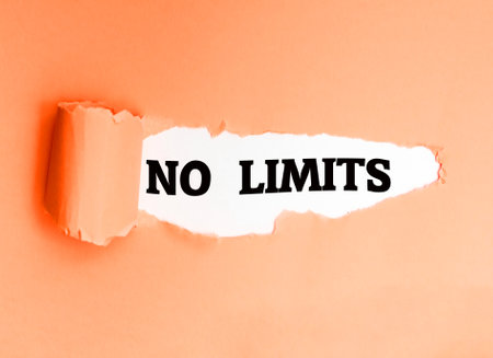 No Limits, written in English on a torn paper, encouraging you to take action and be proactive.の写真素材