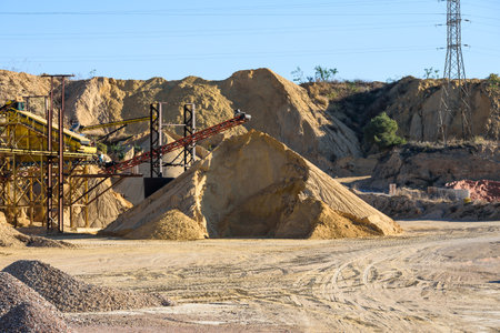 Pile of gravel and sand piled up in a quarry for sale and use in construction.のeditorial素材