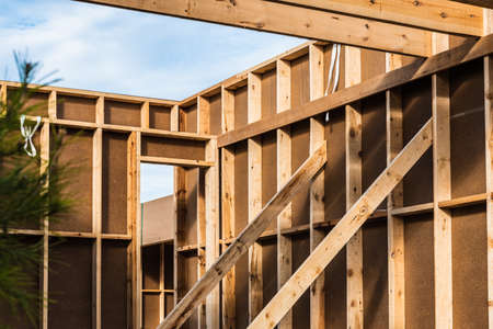 Wood planks s for walls and beams in the construction of a new sustainable wooden house.