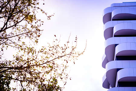 Residential building with a futuristic and minimalist design with a white facade.の写真素材