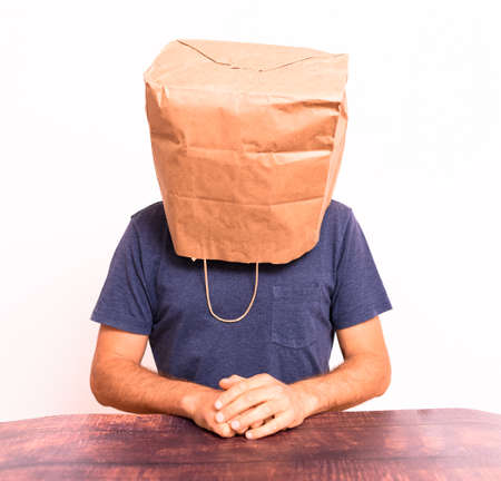 Think and reason but come to no conclusion, wise man with bag on his head.の写真素材