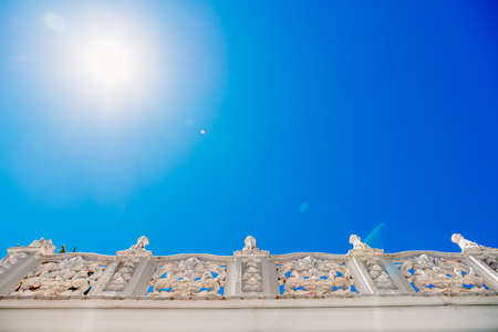 Old style stone balustrade, bottom view with blue sky background and copy space.の写真素材