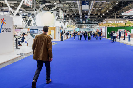 Madrid, Spain - May 20, 2021: Several people walk through the corridors of Ifema in Madrid during the celebration of the Fitur tourism fairのeditorial素材