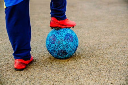 A boy with a soccer ball under his feet.の写真素材
