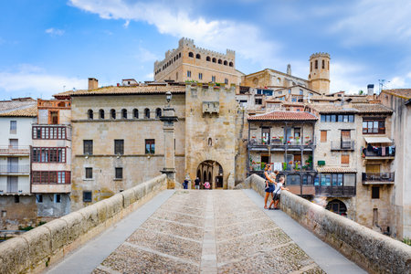 Valderrobres, Spain - July 7, 2021: Stone bridge over the river makes the entrance to the old medieval city of Valderrobres.のeditorial素材