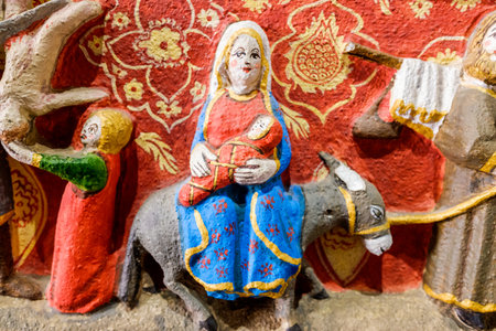 Valencia, Spain - July 9, 2021: Detail of the ancient religious art of the facade of the Apostles of...