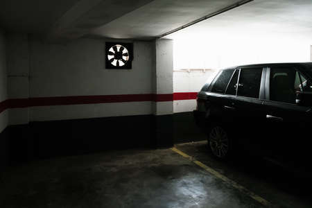 Empty space in an old decrepit and dilapidated underground parking garage.の写真素材