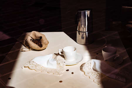 Coffee beans on a white tableclothの写真素材
