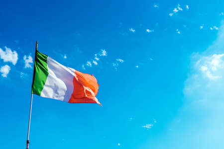 Flag of Italy composed of three colors, national pride, on a sunny summer day.の写真素材