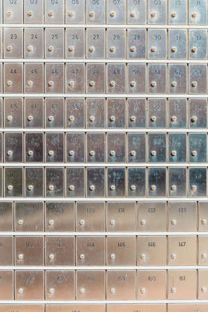 Numbered metal safes to hide secrets in a post office.