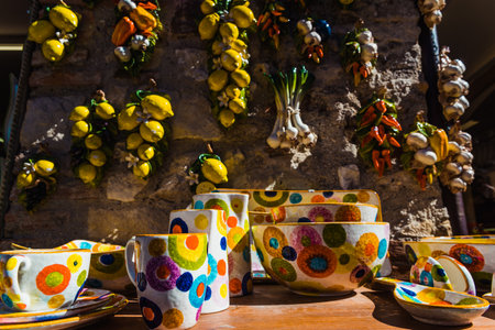 Sirmione, Italy - September 28, 2021: Ceramic souvenirs shaped like lemons and garlic.のeditorial素材