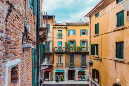 Verona, italy - october 1, 2021: alleys of Verona among which you can see the duomo and the castle.のeditorial素材